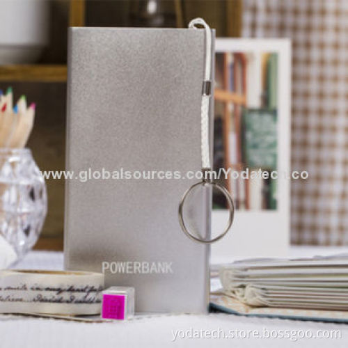 Power bank XCQ is ultra-thin, genuine leather appearance and has a mobile phone holster texture